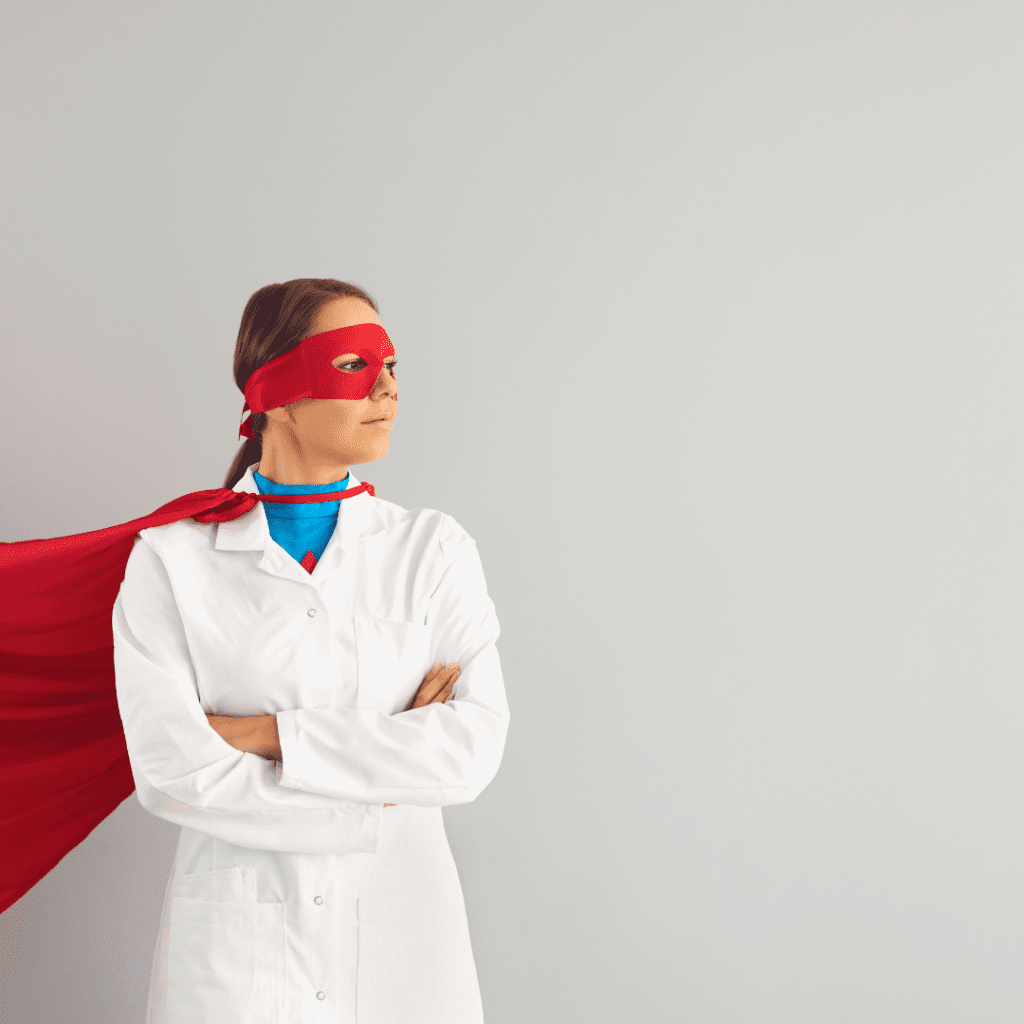 Female dentist wearing cap & mask dressed as superhero